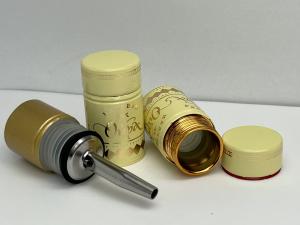 Metal-polymer cap with a hole for inserting a geyser